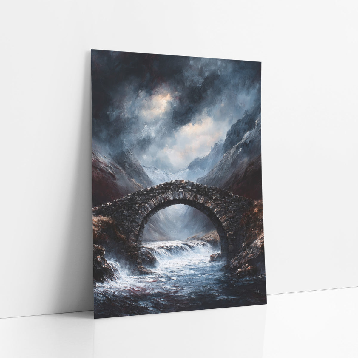 Snowpeak Torrent Bridge Gothic art print leaning against a white wall – dark stone arch bridge over a foaming mountain river