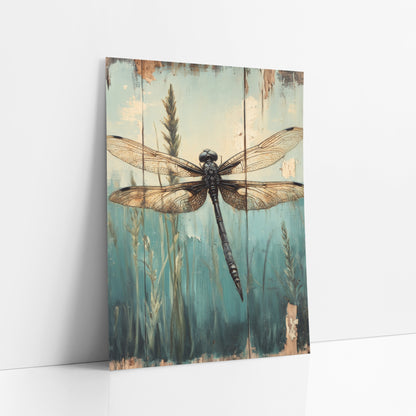 Dark Dragonfly Reeds Vintage Botanical art print leaning against a white wall – black dragonfly with amber veined wings above