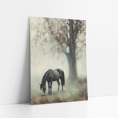 Grazing Horse Misty Landscape art print leaning against a white wall – dark brown horse grazing with head lowered beneath
