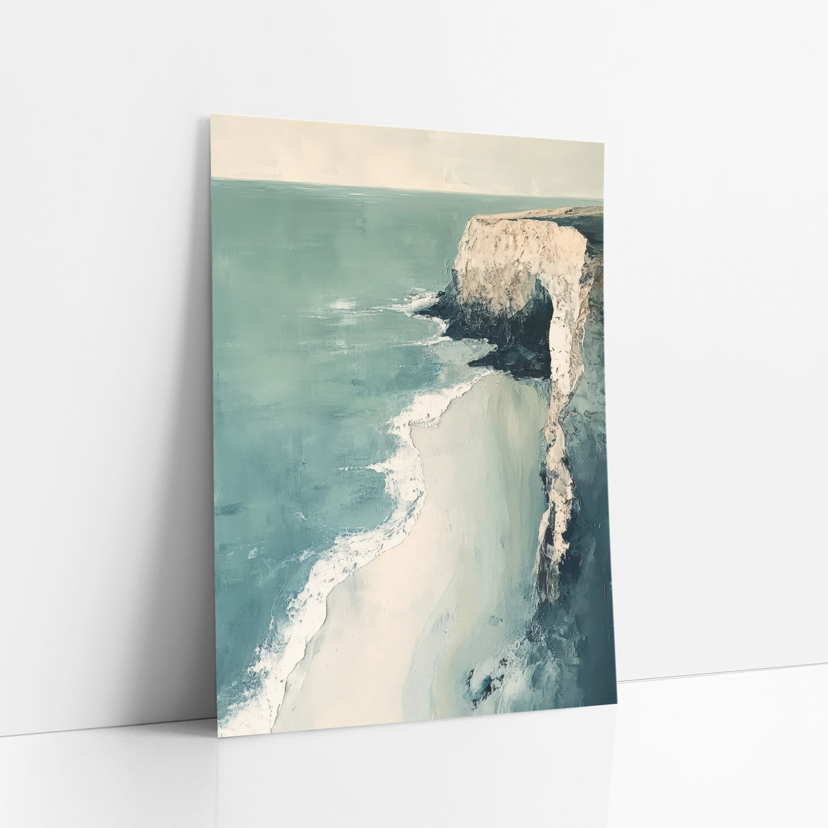 Pale Cliff Coastal Seascape Abstract art print leaning against a white wall – pale cliff with a dark arch above a teal sea