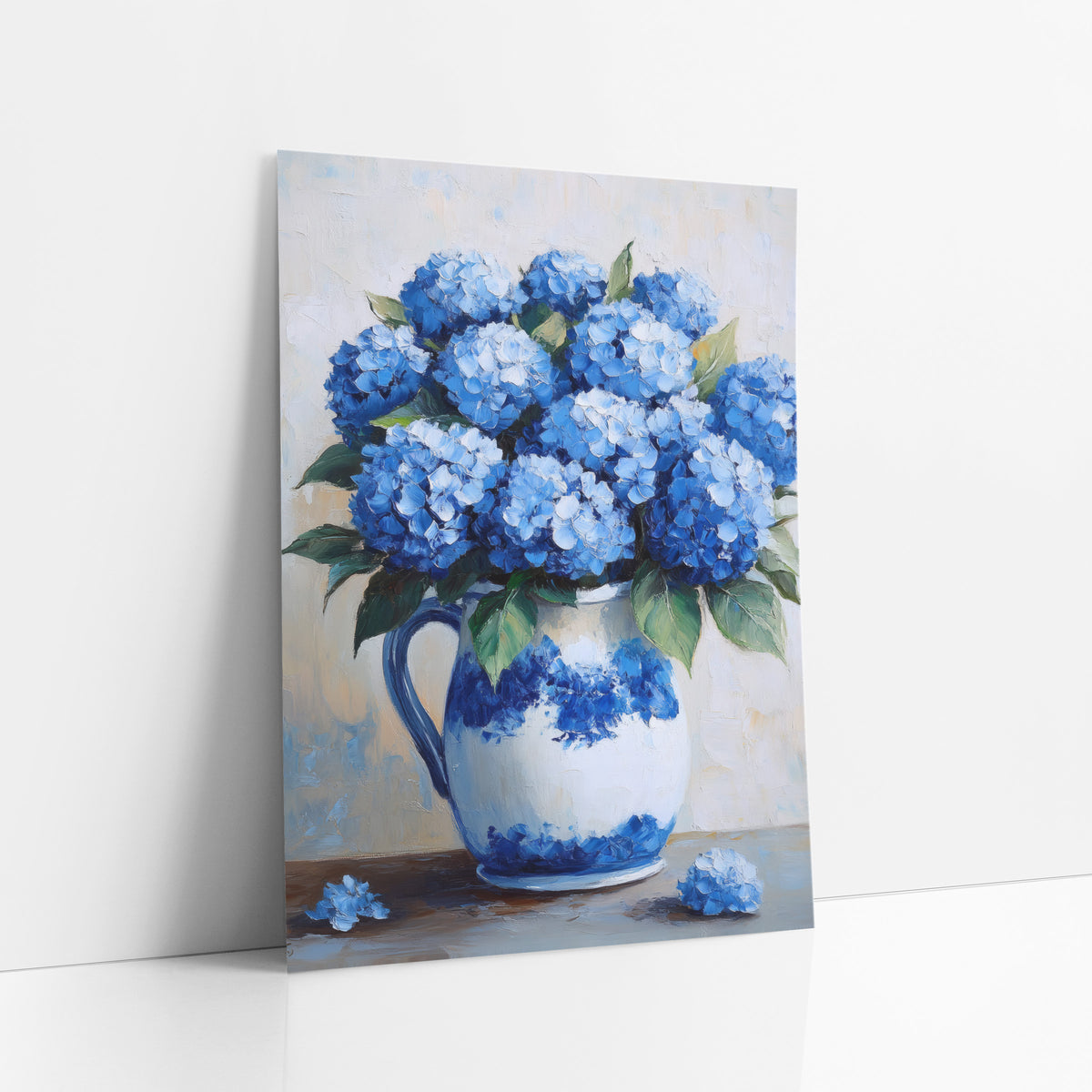 Blue Hydrangea Fallen Blooms Coastal art print leaning against a white wall – blue hydrangea bouquet in a white and blue