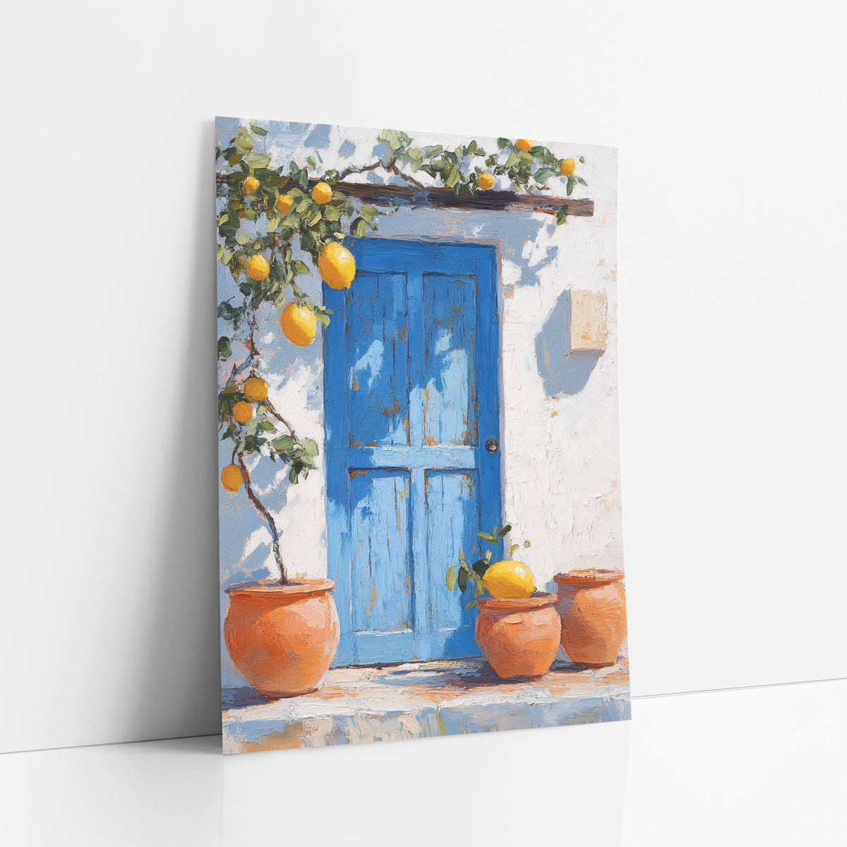 Sunlit Lemon Doorstep Three Pots Coastal art print leaning against a white wall – blue wooden door on a white wall with lemon