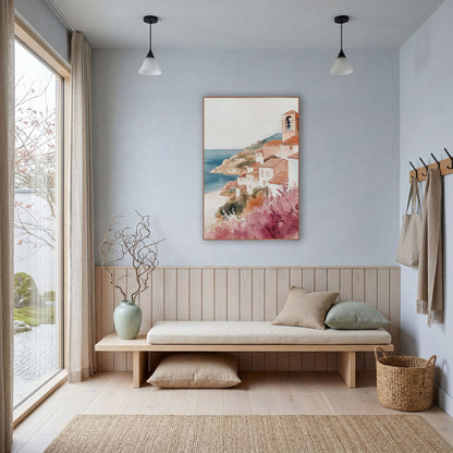Pink Blossom Hillside Village Coastal wall art in a bright coastal-style room – watercolor-style seaside village
