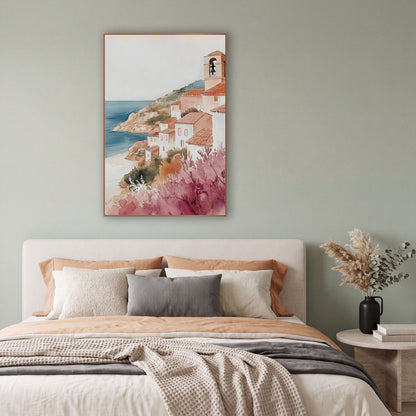 Pink Blossom Hillside Village Coastal wall art in a bright coastal-style room – watercolor-style seaside village