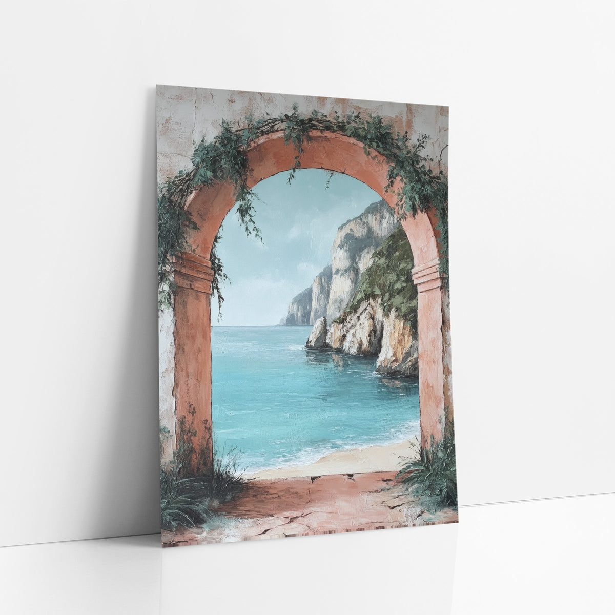 Blush Arch Limestone Bay Coastal art print leaning against a white wall – terracotta arch with green vines framing