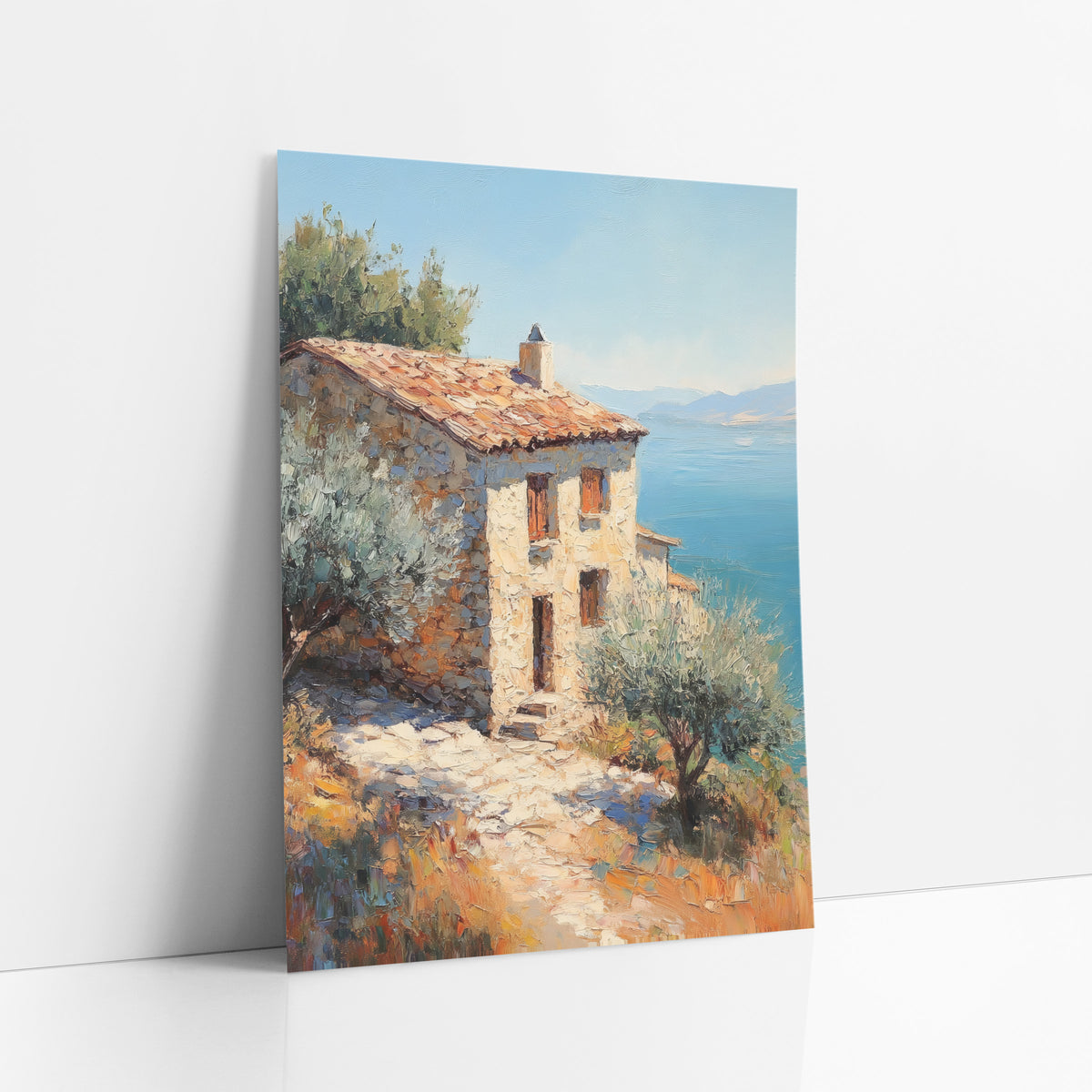 Terracotta Roof Cliffside Cottage Rustic art print leaning against a white wall – stone cottage with orange tile roof