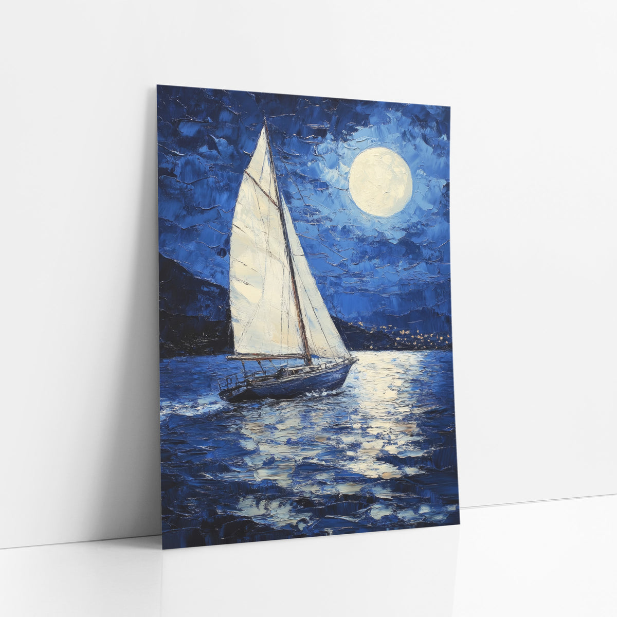 Moonlit Sailboat Deep Blue Coastal art print leaning against a white wall – white sailboat on dark blue water under a full