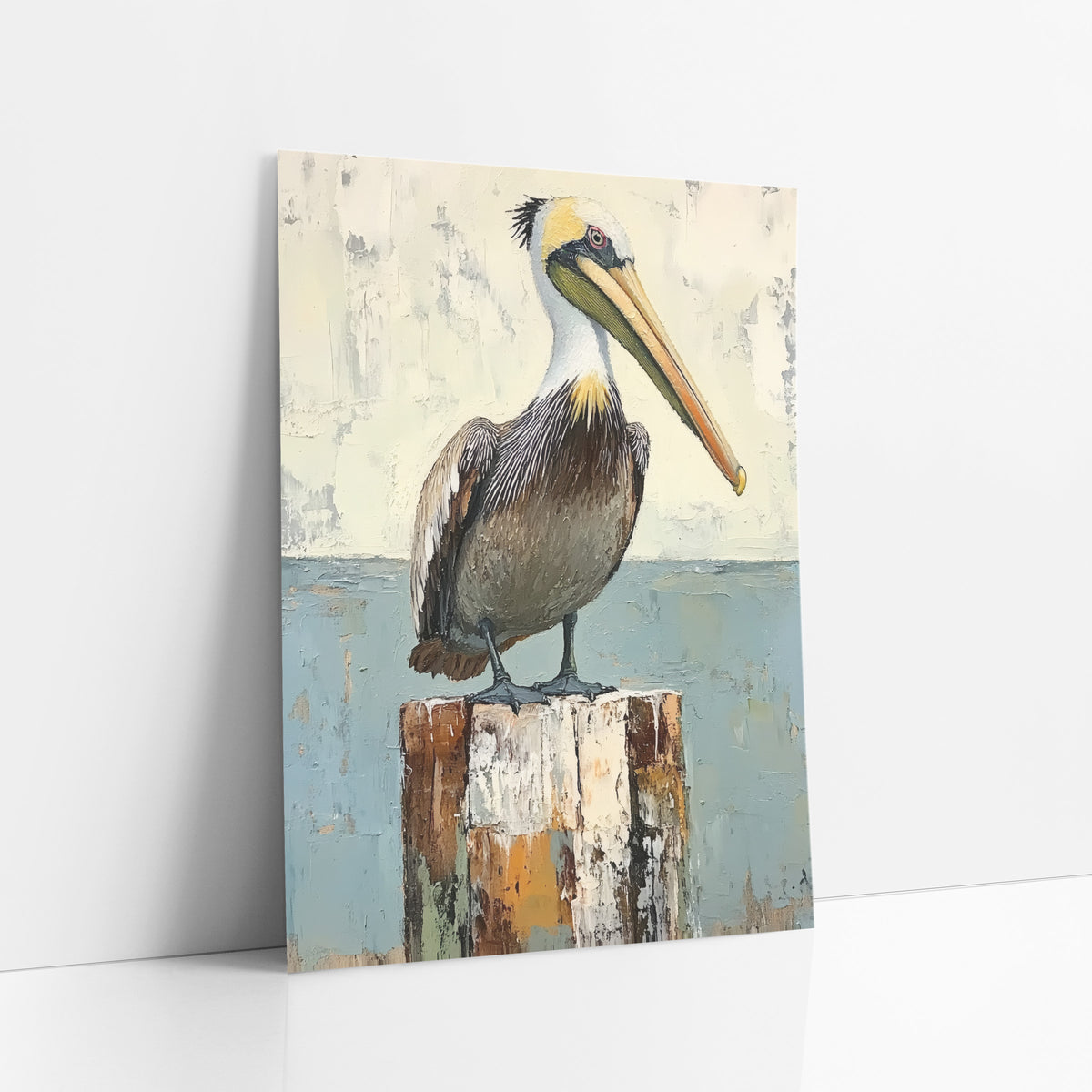 Standing Pelican Blue Horizon Coastal art print leaning against a white wall – brown pelican with long pale bill standing