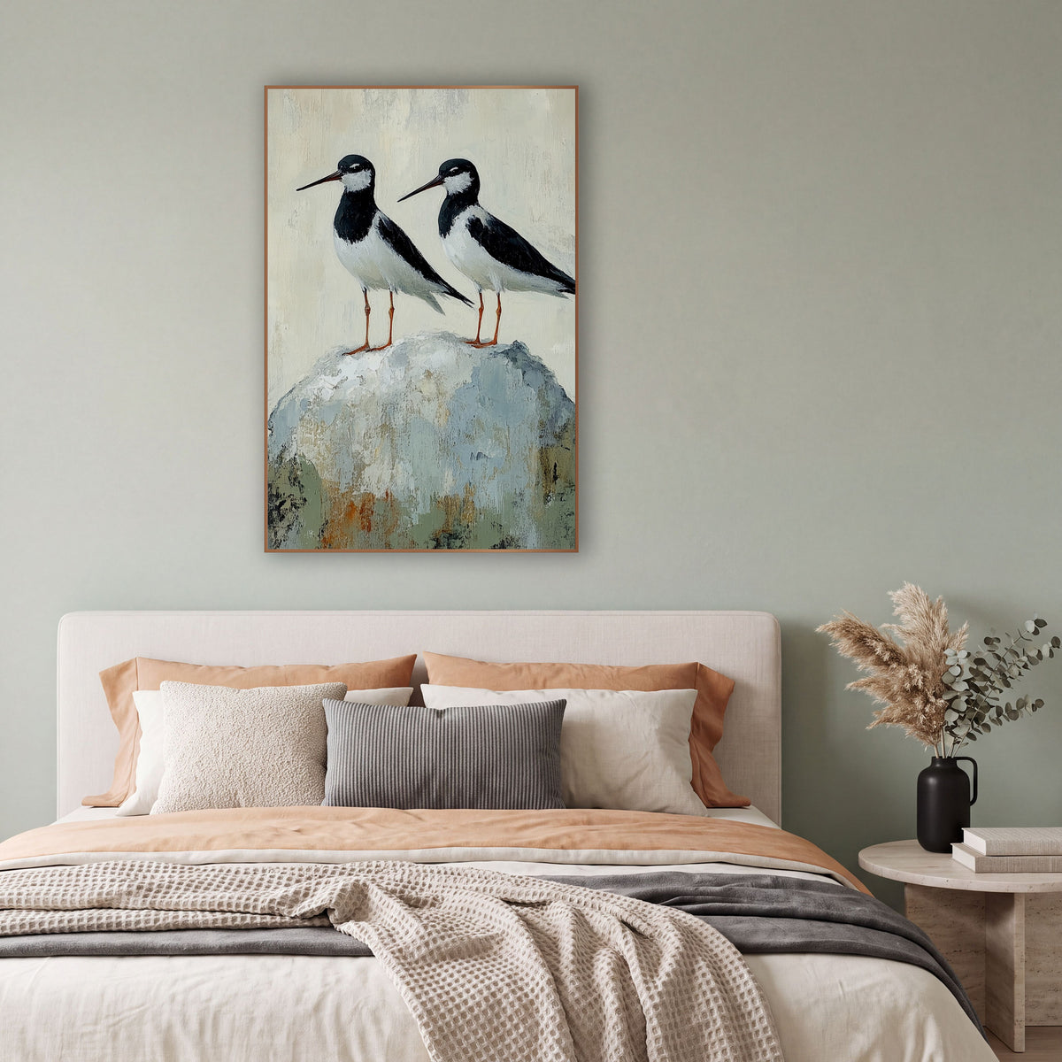 Twin Stilts Gray Boulder Coastal wall art in a bright coastal-style room – two black and white shorebirds with long
