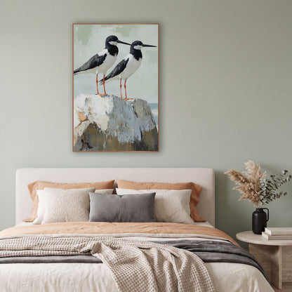 Black White Shorebird Pair Coastal wall art in a bright coastal-style room – two black and white shorebirds