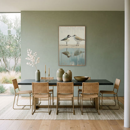 Two Plovers Coastal Shoreline Reflection wall art in a bright coastal-style room – two plovers face each other