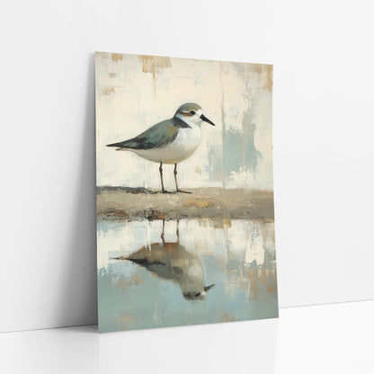 Plover Shoreline Reflection Coastal Neutral art print leaning against a white wall – small plover with sage-gray back
