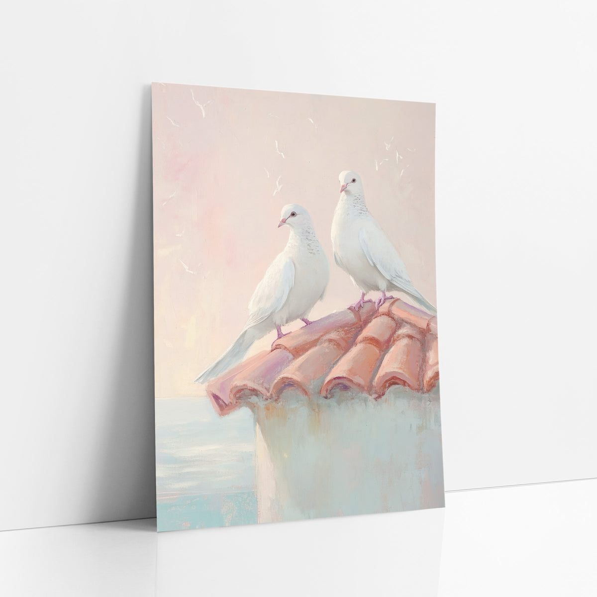 Doves Gazing Outward Pastel Coastal art print leaning against a white wall – two white doves perched on a terracotta tile