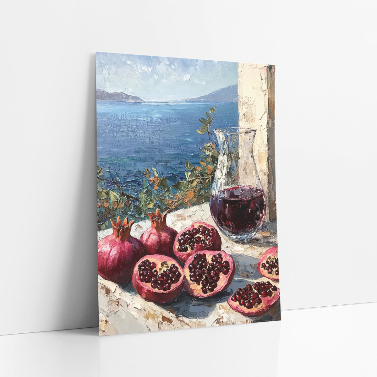Pomegranate Carafe Bay View Mediterranean art print leaning against a white wall – halved and whole pomegranates